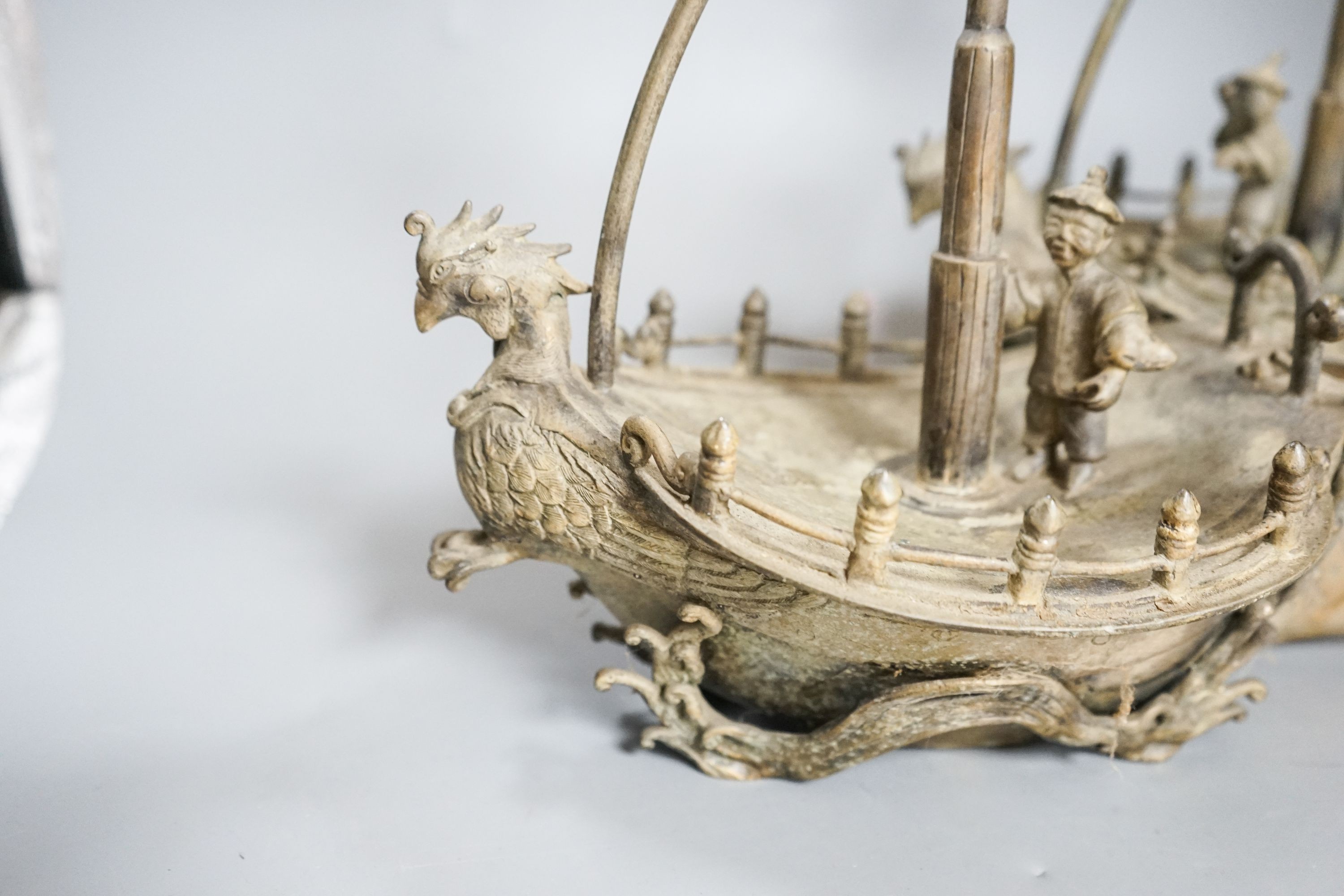 A pair of Chinese brass ‘ship’ lamp stands, 41cm